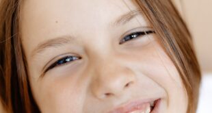 Adorable child's joyful expression in close-up portrait.
