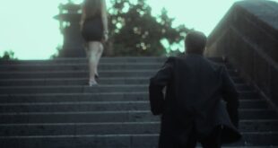 A man runs up steps after a woman in an urban setting, captured in a cinematic style in Mexico City.
