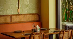 Warm interior of an Accra restaurant with seating and decor, perfect for dining.