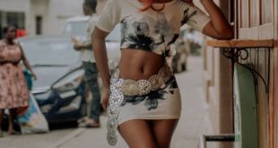 A fashionable young woman poses stylishly on the streets of Accra, Ghana.