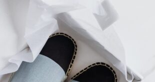 Elegant espadrilles in a box, showcasing fashion-forward style and online purchase convenience.