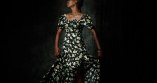Artistic portrait of a woman in a floral dress, gracefully captured in motion.