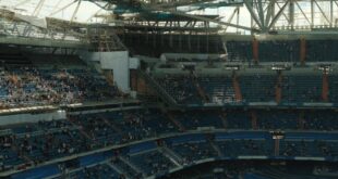 Vibrant view of a football stadium filled with fans, capturing the energy of a live match.