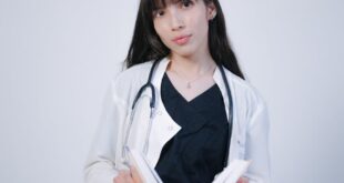 A young medical student studies with a stethoscope, emphasizing education.