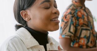 Two young adults sharing an intimate and joyful moment together indoors.