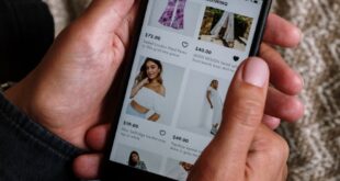 Close-up of a person shopping for clothing on a smartphone, highlighting the modern digital lifestyle.