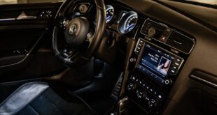 Explore the modern Volkswagen interior parked in a spacious garage in Kraków.