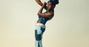 Female model in denim performing a dynamic dance move, showcasing energy and style.
