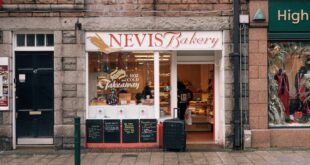 Front view of Nevis Bakery, showcasing cozy street scene in Fort William, Scotland.