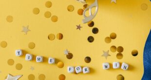 Gold trophy and medal with celebratory confetti and motivational message.