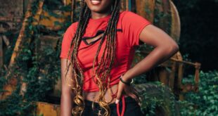 Vibrant portrait of a smiling young woman standing outdoors in Aburi, Ghana.