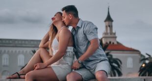 A couple shares an intimate moment outdoors in Split, Croatia, showcasing affection and romance.