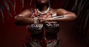 Powerful expression of African culture through traditional dance and attire.